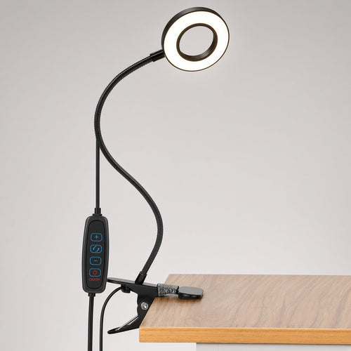 Black USB clip-on ring desk lamp clamped to a desk edge, with inline remote for brightness, color mode and power